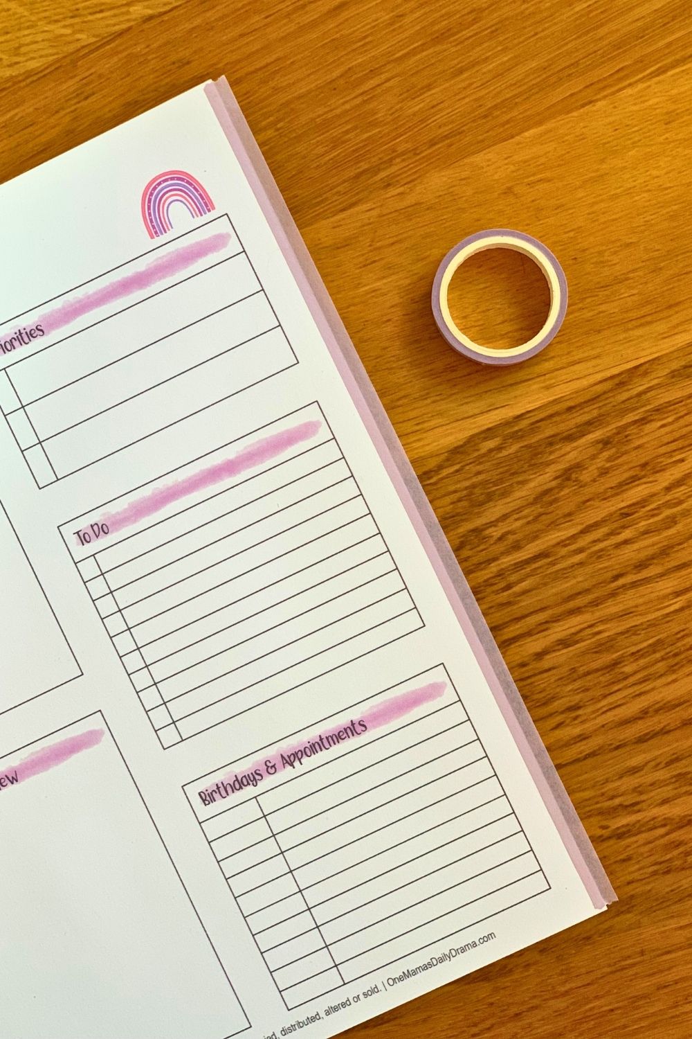Pink washi tape stuck and overlapping the right edge of paper.