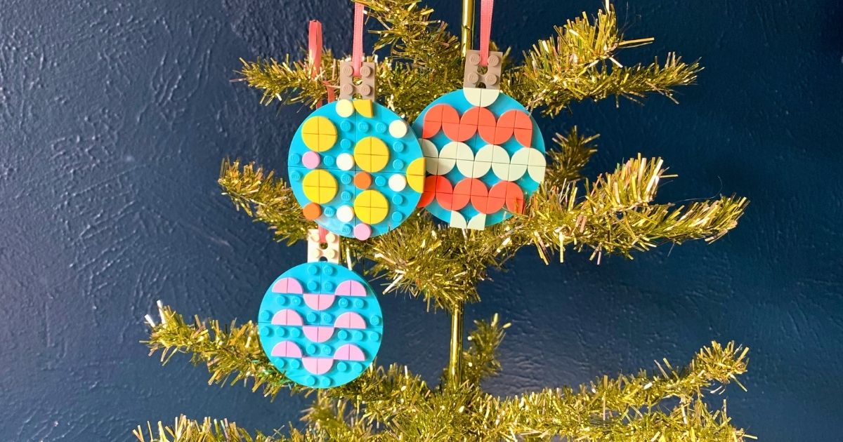 Three flat LEGO ball ornaments decorated with colorful dots in patterns.