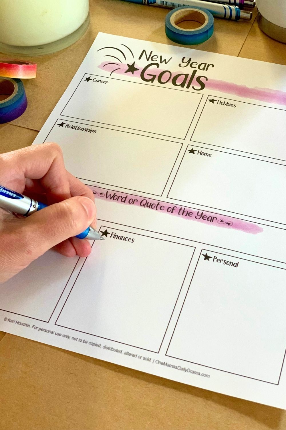Filling in boxes on a worksheet with 7 categories: career, hobbies, relationships, home, health, finances, and personal.