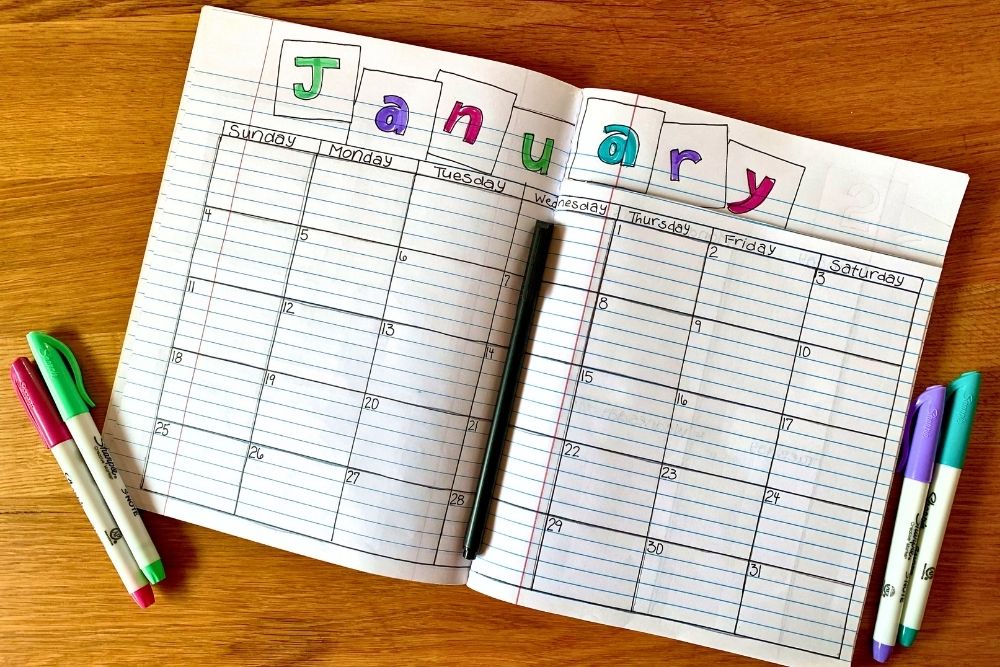 A monthly calendar grid on the bottom half pages with January in boxes across the top.