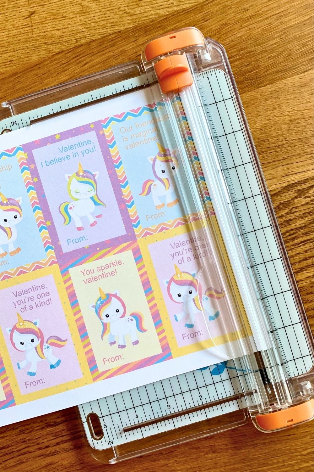 Cutting out the cards using a sliding paper trimmer.