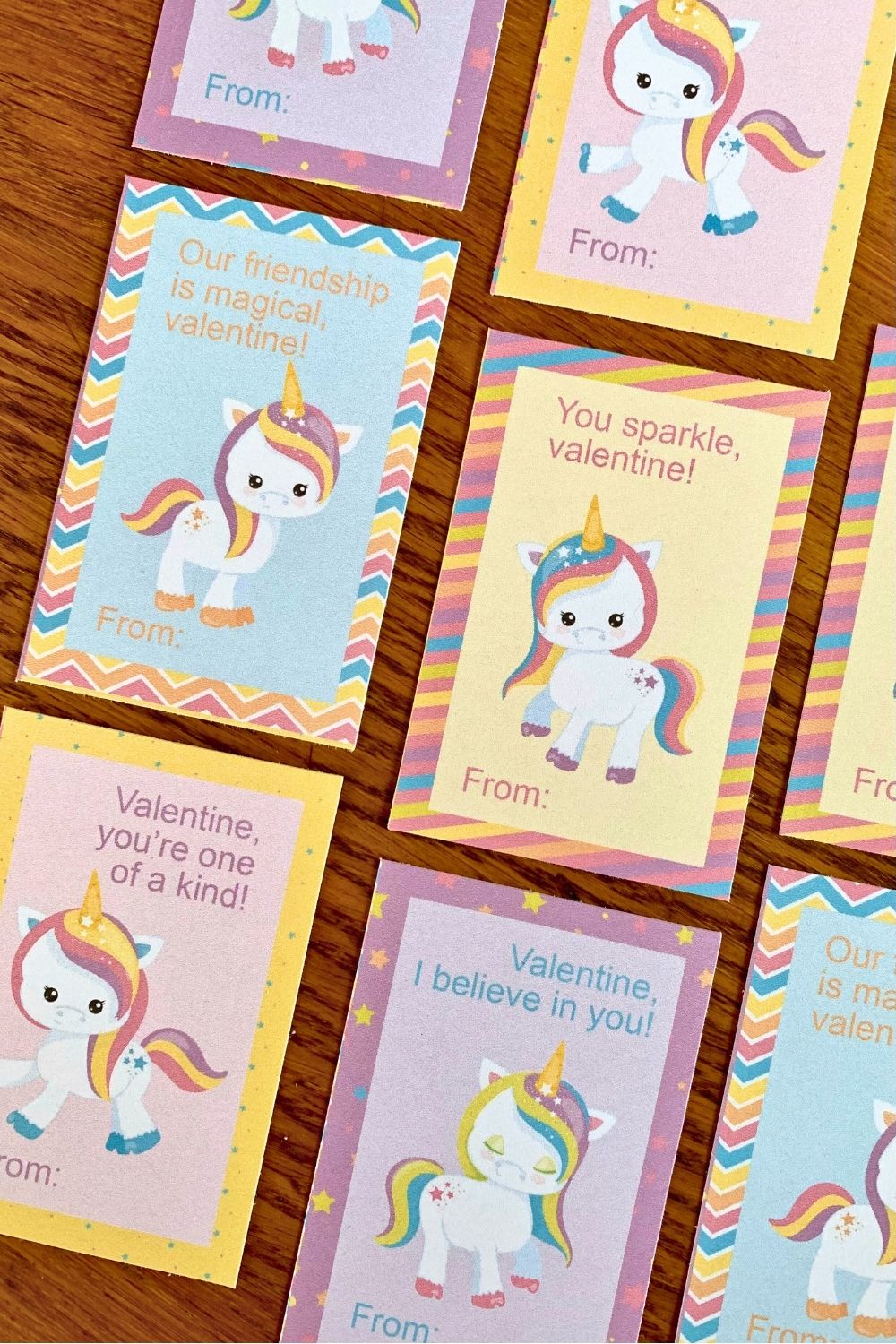 Printed rainbow unicorn valentine cards with cartoon clipart and sweet wishes.