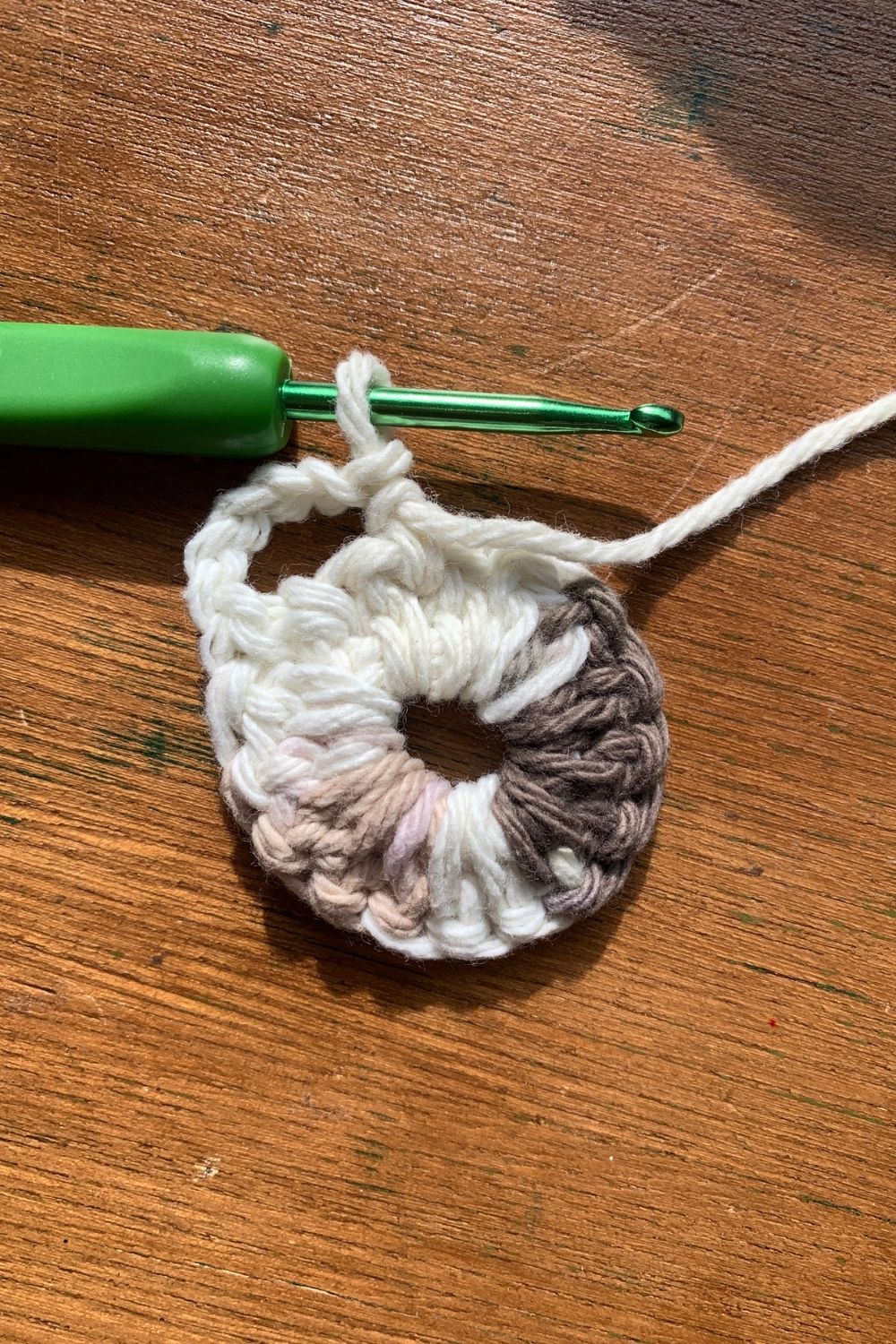 Beginning a round of single crochet with a chain of 5 stitches.