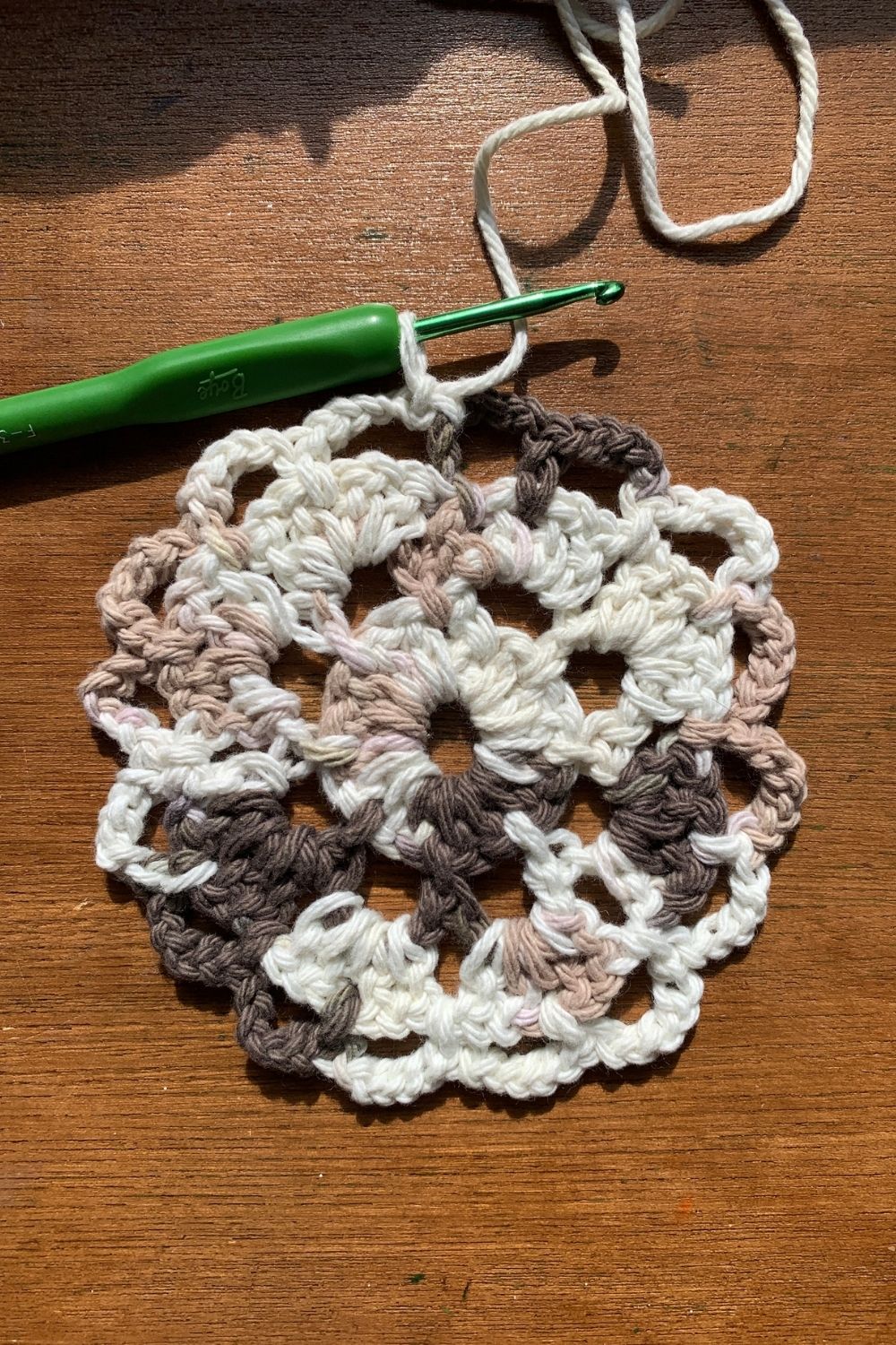 Completing a round of single crochet into every other gap with a chain of 5.