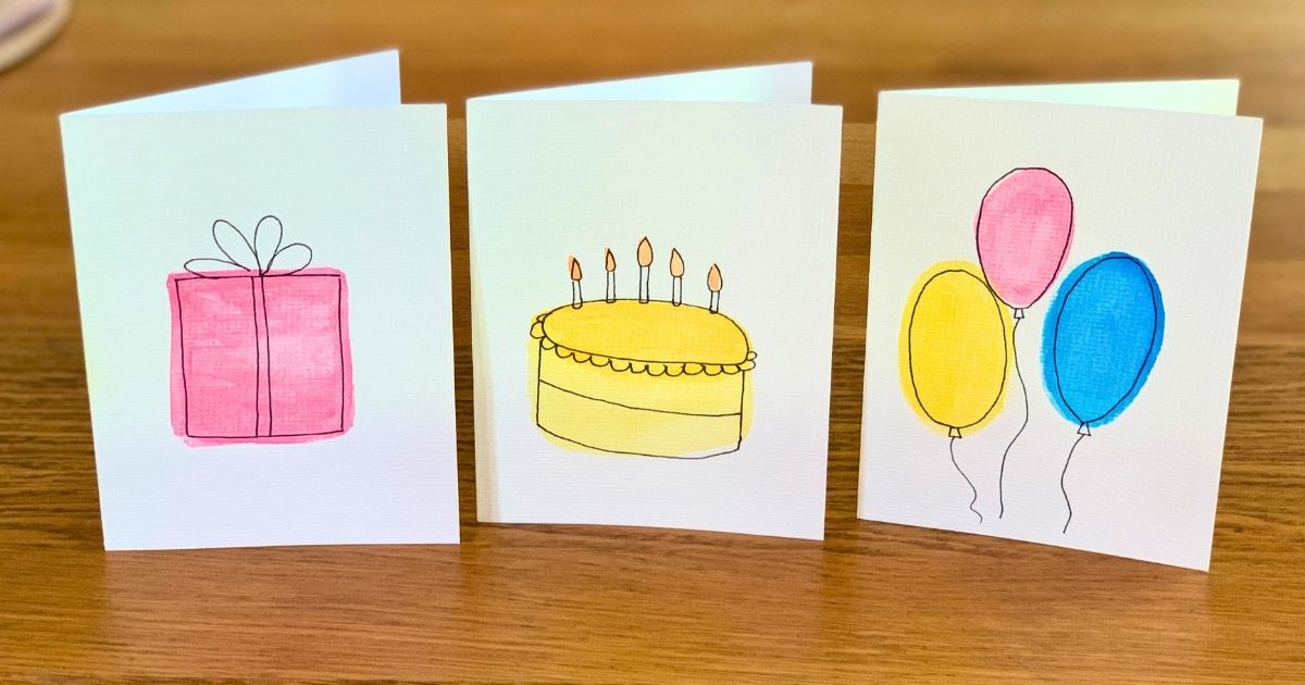 DIY birthday cards with watercolor gift, cake, and balloons.