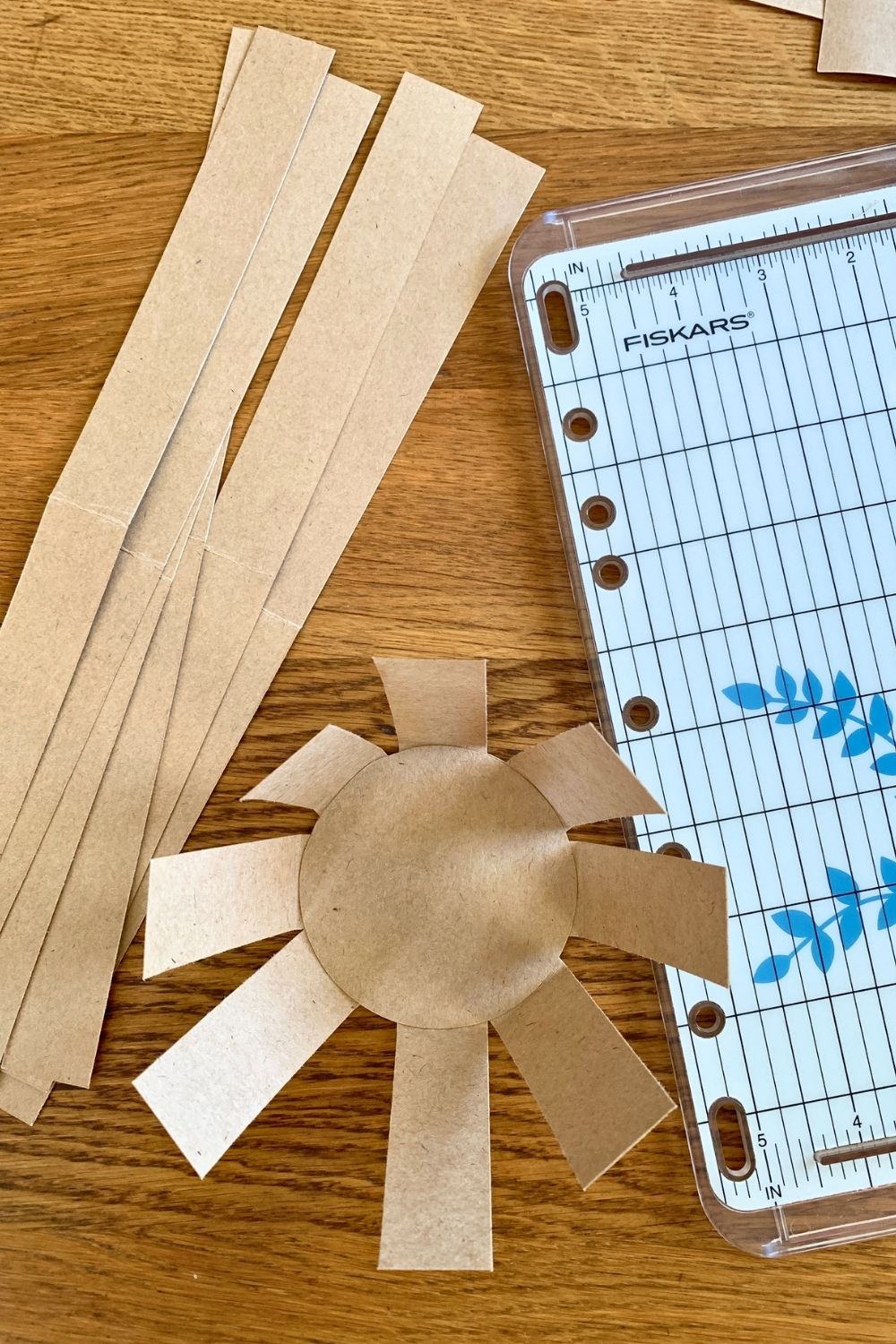 Kraft paper strips beside a basket weaving base.