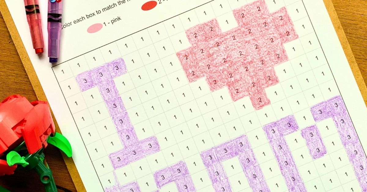 Closeup of a Mother's Day color by number printable with numbered boxes colored purple and red to show I heart mom.