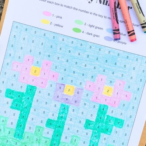 Printable spring color by number with a pixel grid and 3 pink and purple flowers with green leaves.