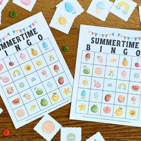 Summer bingo cards surrounded by draw cards with watercolor clipart of fruits, beach items, and seasonal nature.