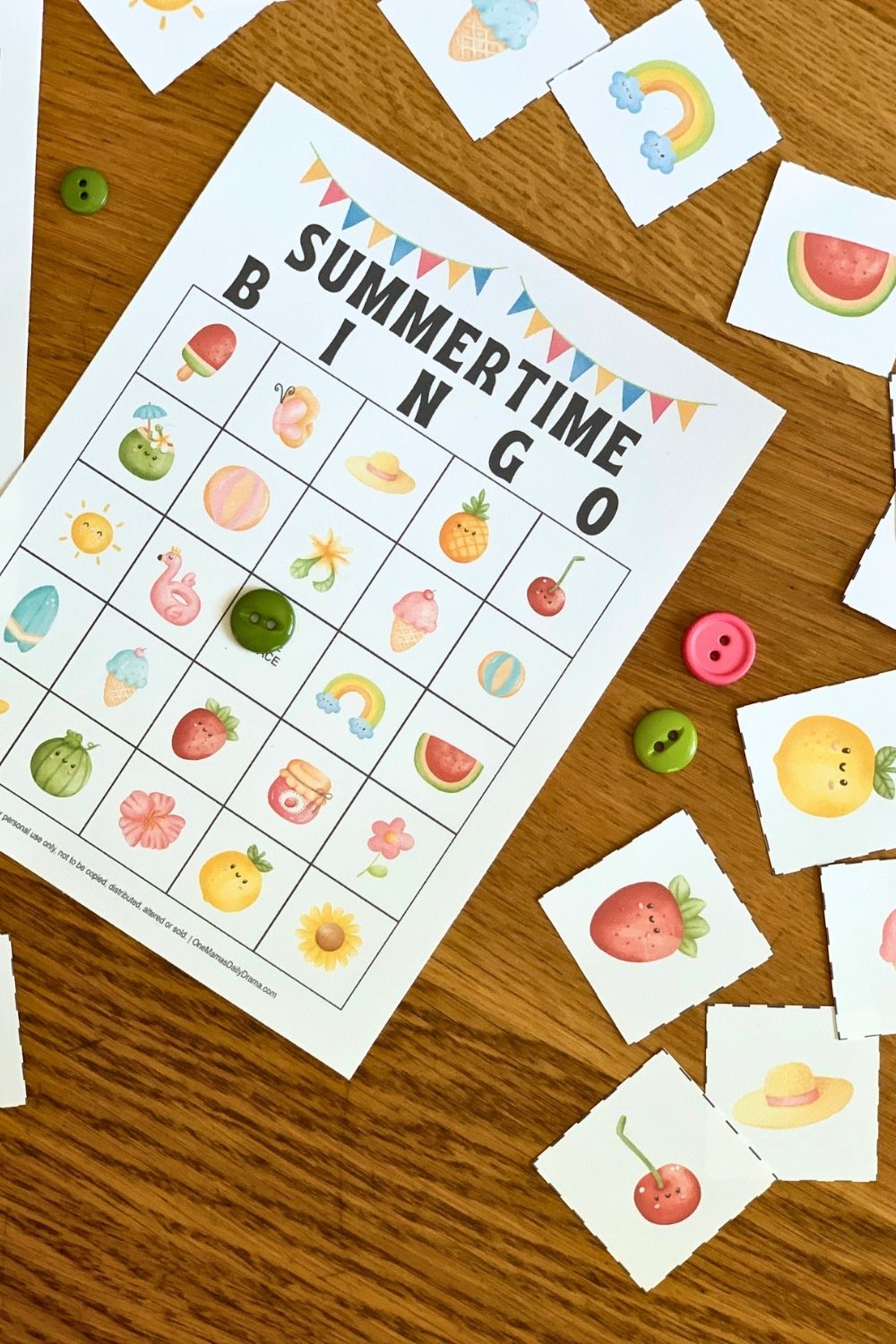 Summer bingo cards surrounded by draw cards with watercolor clipart of fruits, beach items, and seasonal nature.