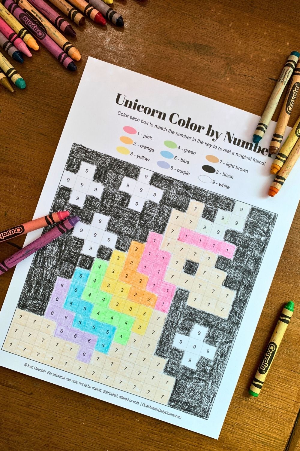 Unicorn color by number with rainbow striped mane and black background.