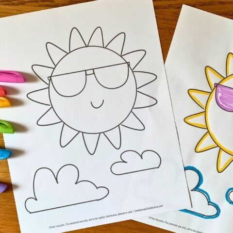 Blank and colored printable sun coloring page beside markers.