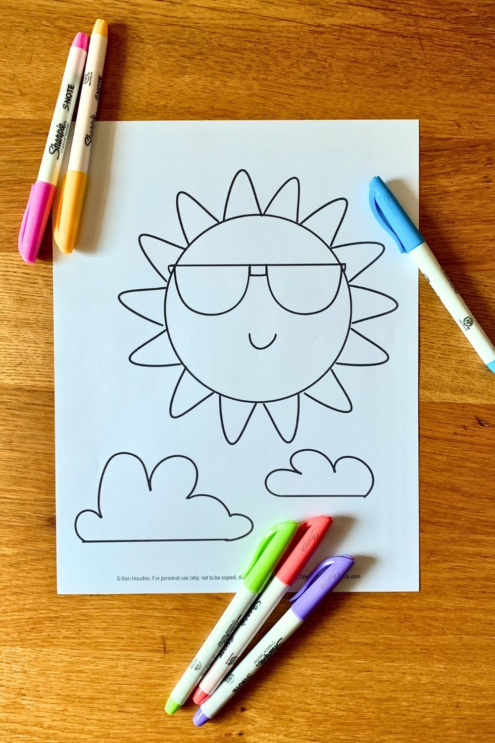The sun coloring page with a large spiky sun wearing sunglasses beside a pari of fluffy clouds.