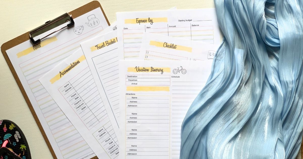 Stack of printable vacation planner pages including accommodations, bucket list, expense log, checklist, and itinerary.