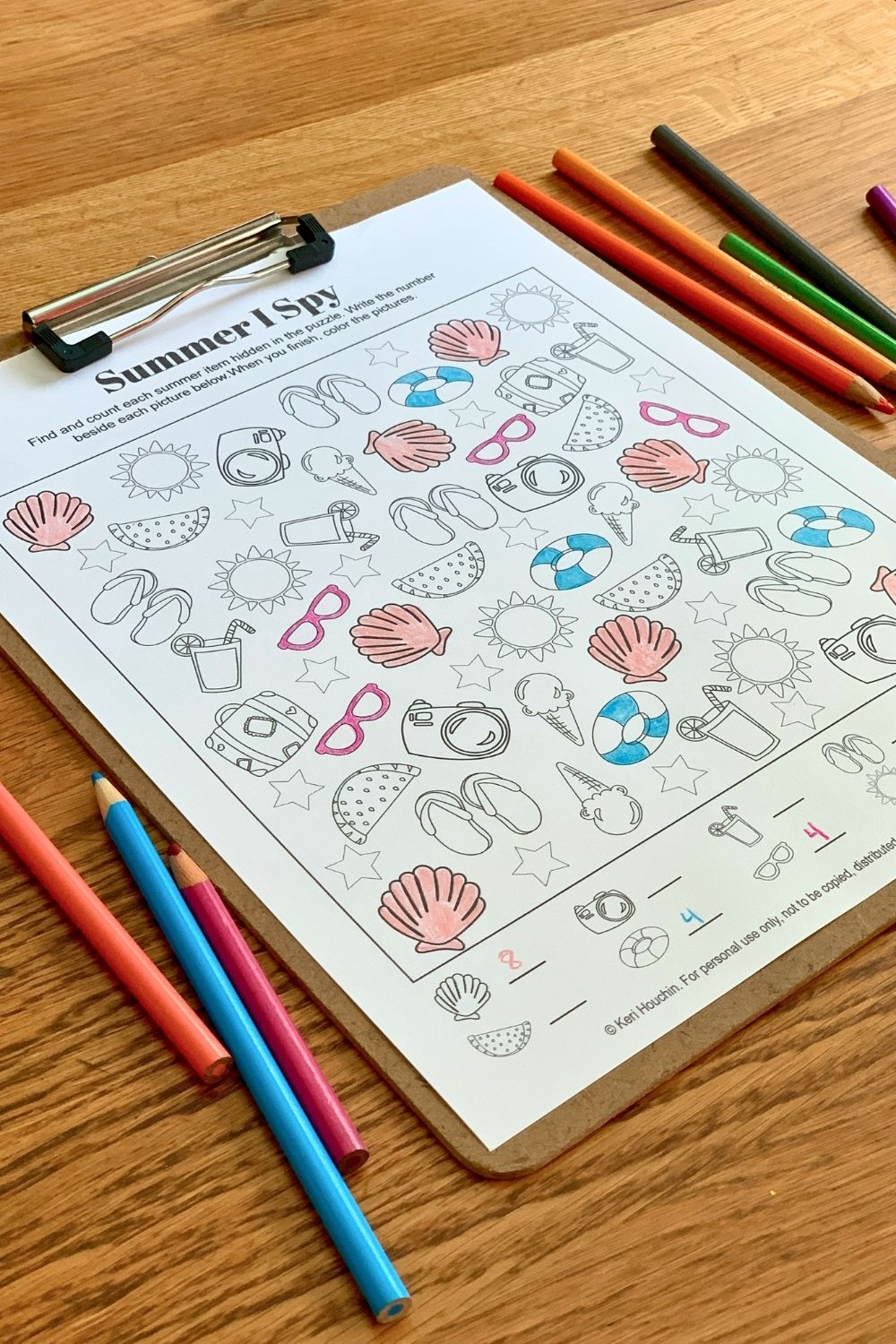 Coloring pink seashells, blue floats, and purple sunglasses.