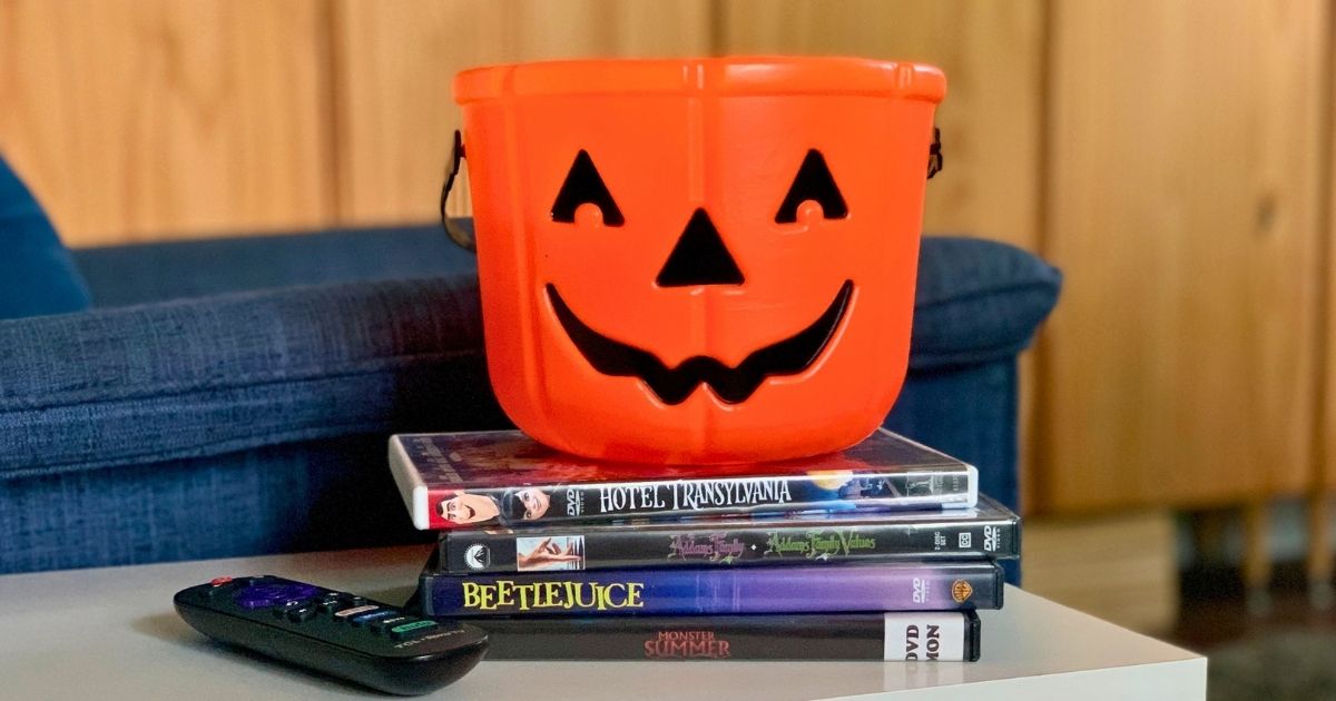 A stack of Summerween movies including Hotel Transylvania, Addams Family Values, Beetlejuice, and Monster Summer.