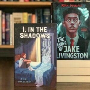 Two hardcover books: I, In the Shadows by Tori Bovalino and The Taking of Jake Livingston by Ryan Douglass.