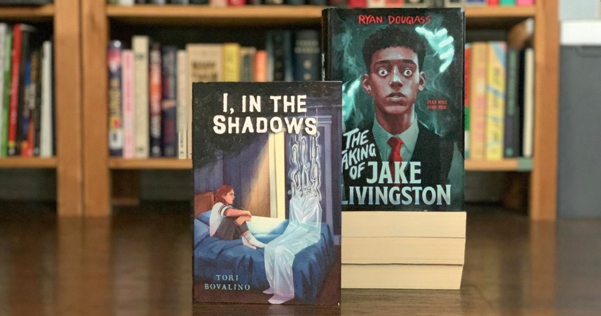 Two hardcover books: I, In the Shadows by Tori Bovalino and The Taking of Jake Livingston by Ryan Douglass.