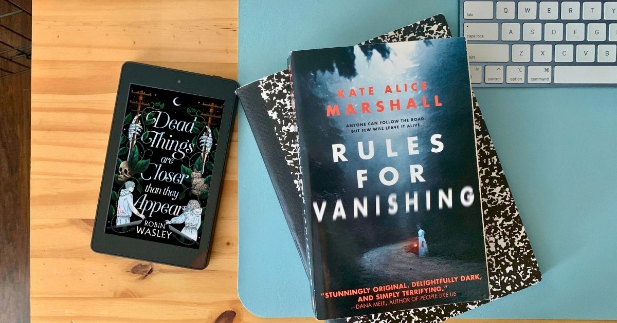 Paperback of Rules for Vanishing by Kate Alice Marshall beside an ereader showing Dead Things Are Closer Than They Appear by Robin Wasley.