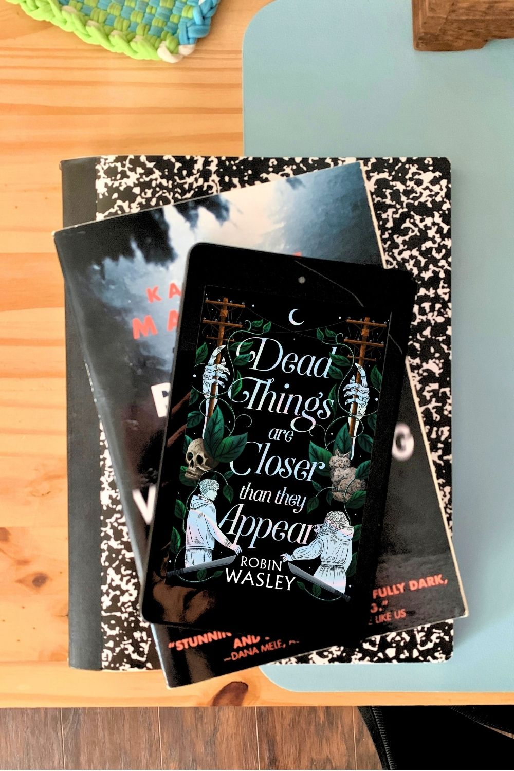 Ebook of Dead Things Are Closer Than They Appear by Robin Wasley on an ereader.