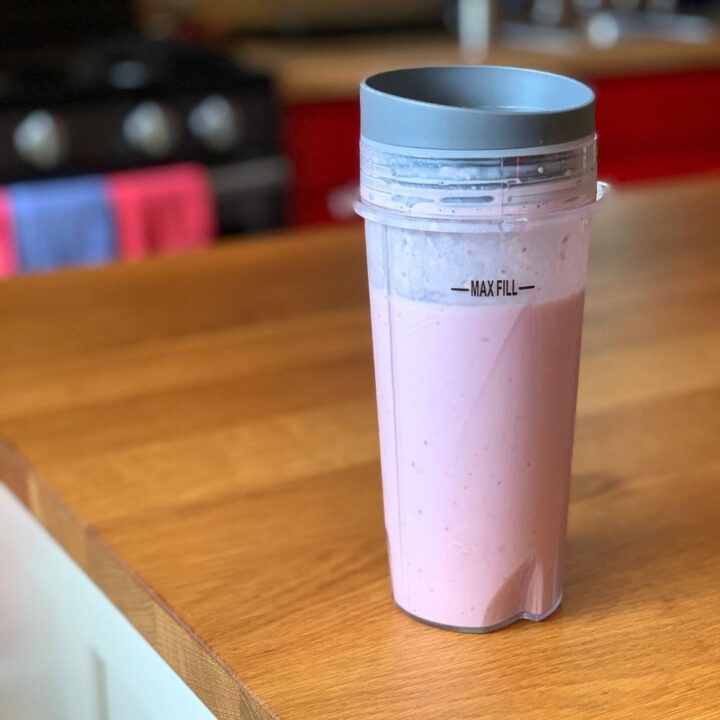 Cherry pie smoothie in a blender cup.