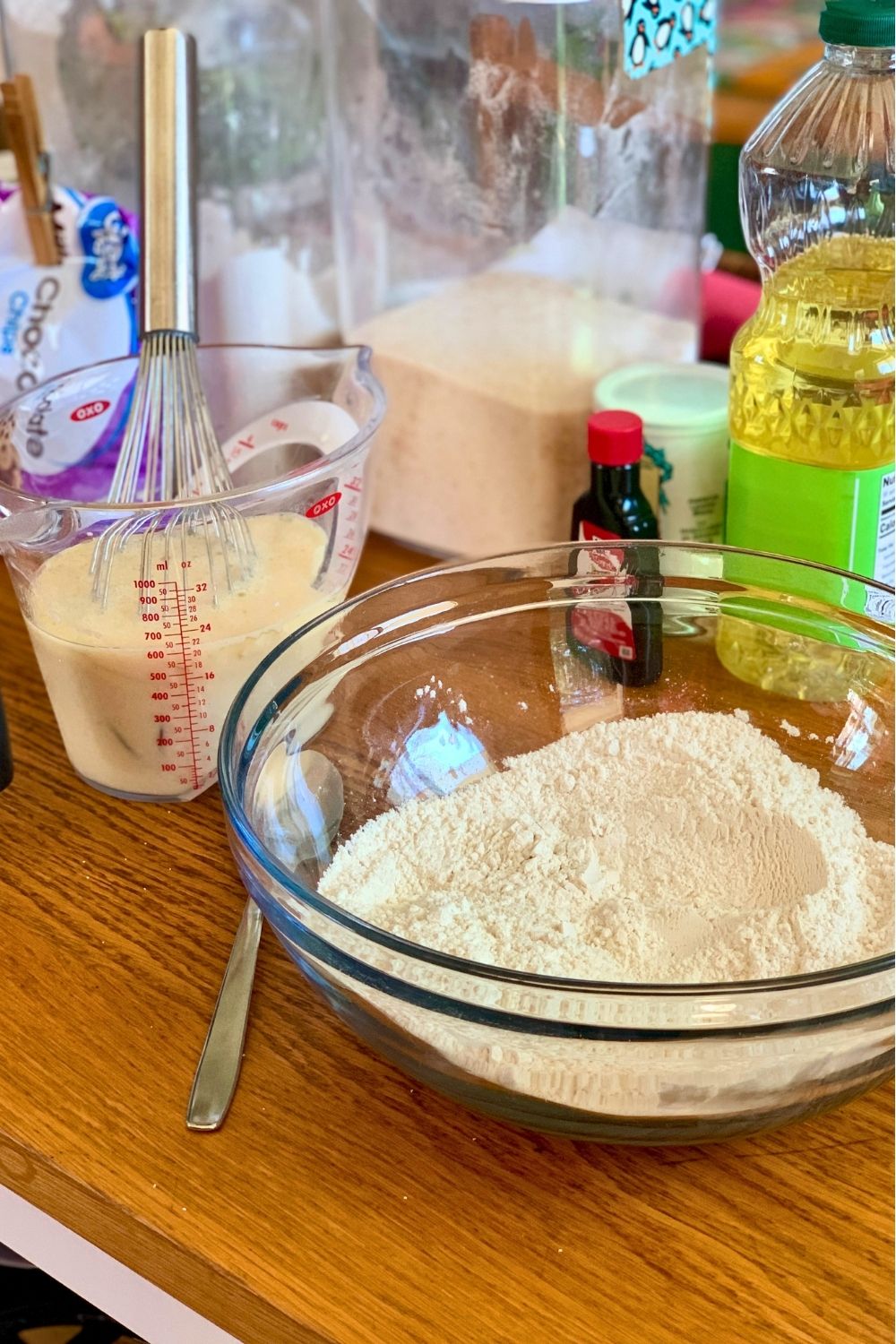 A mixing bowl of flour, sugar, and baking powder.