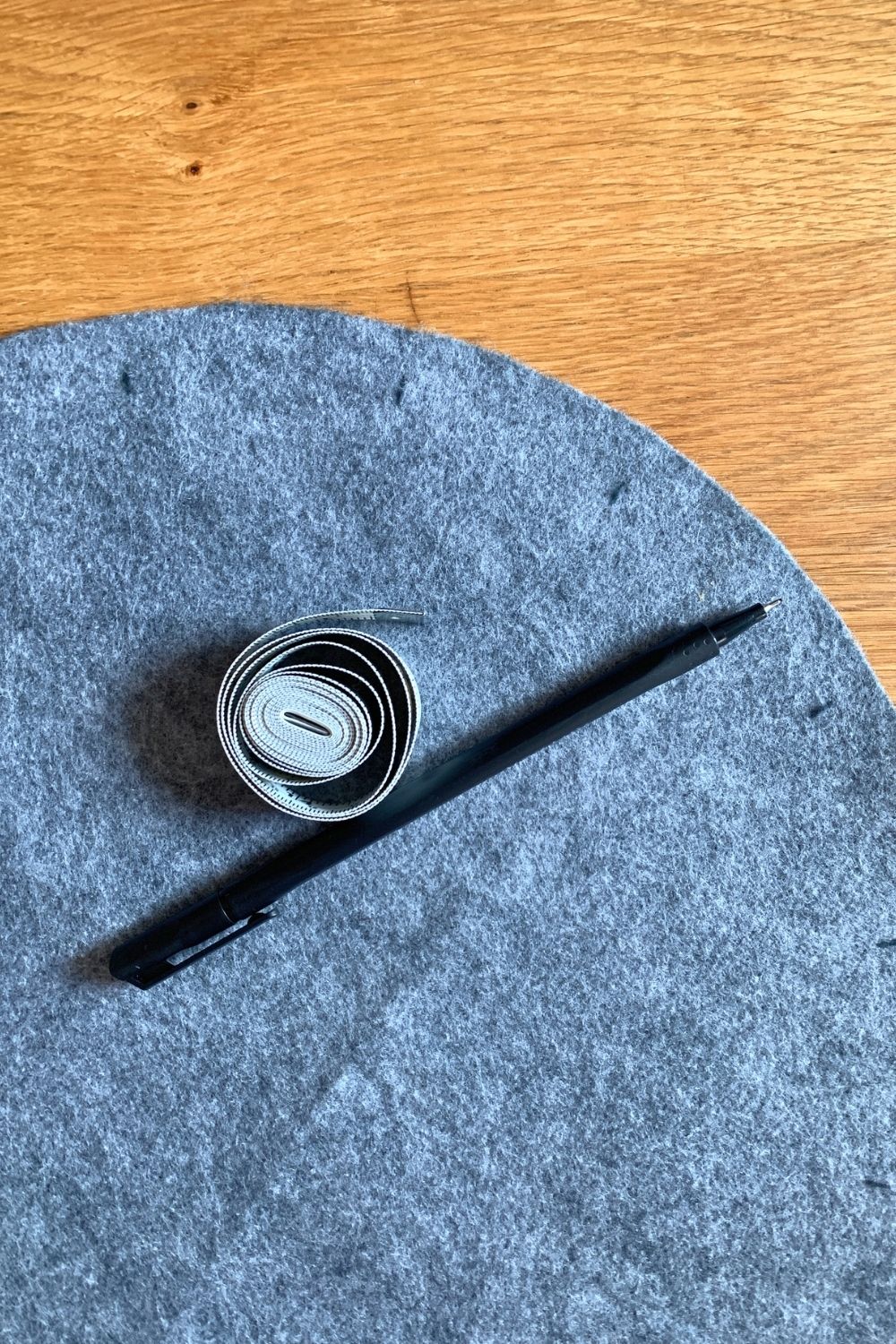 Gray felt with short marks around the edge.