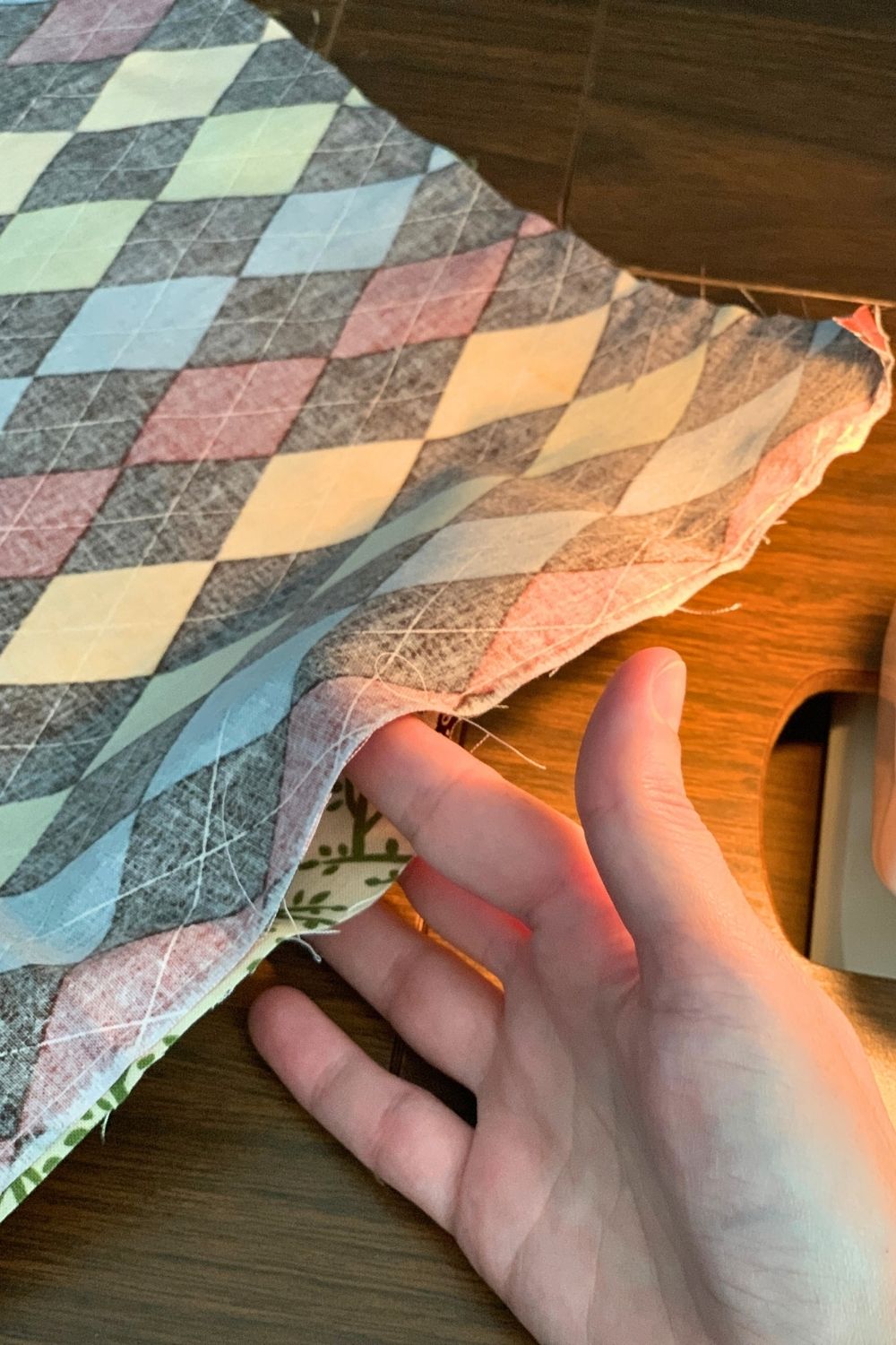 Turning the hemmed fabric right side out through a small opening.
