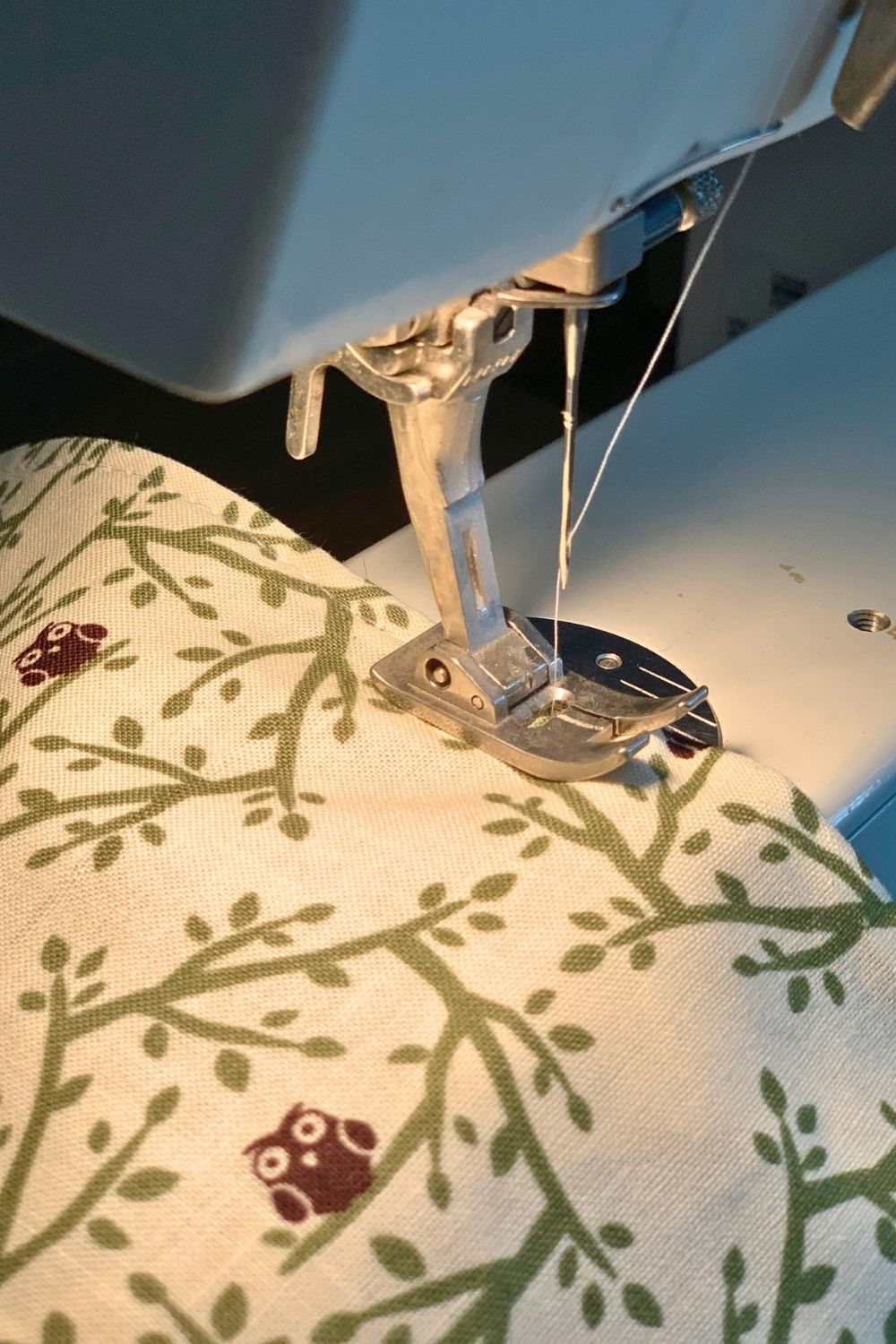 Sewing along the finished edge of the fabric.