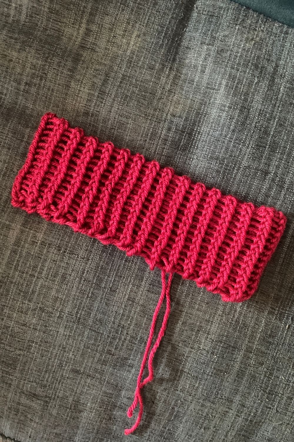 Shaping a yarn headband into a flat rectangle.