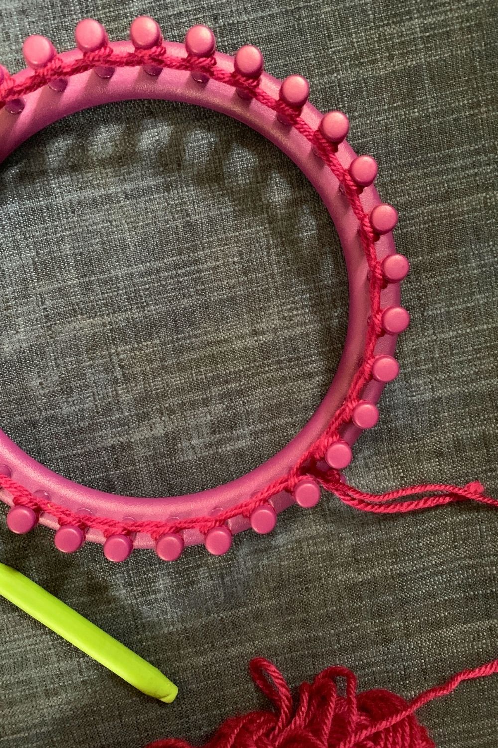 A knitting loom with the first row knit around.