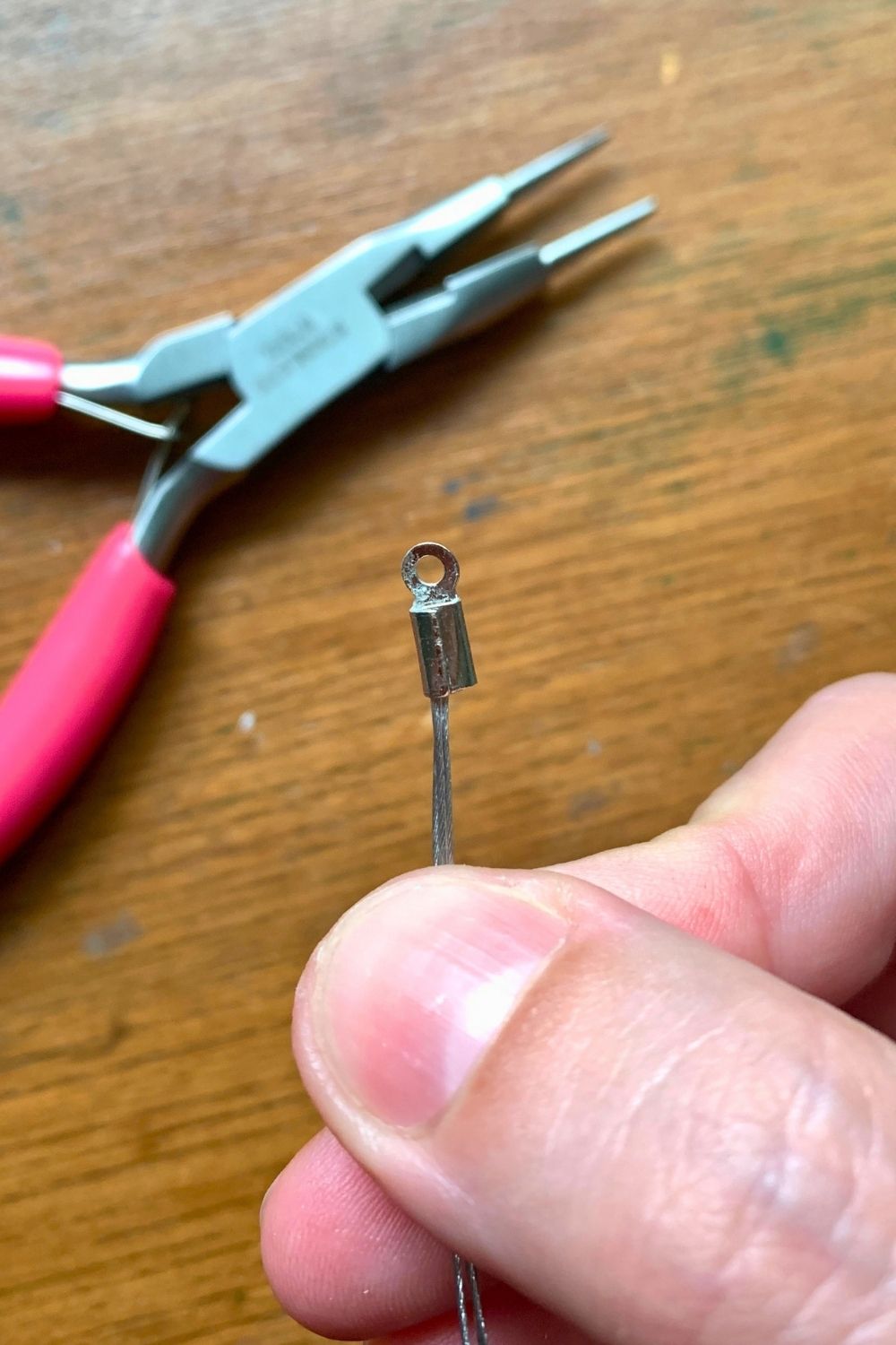 Holding a group of 3 jewelry wires closed inside an end crimp.
