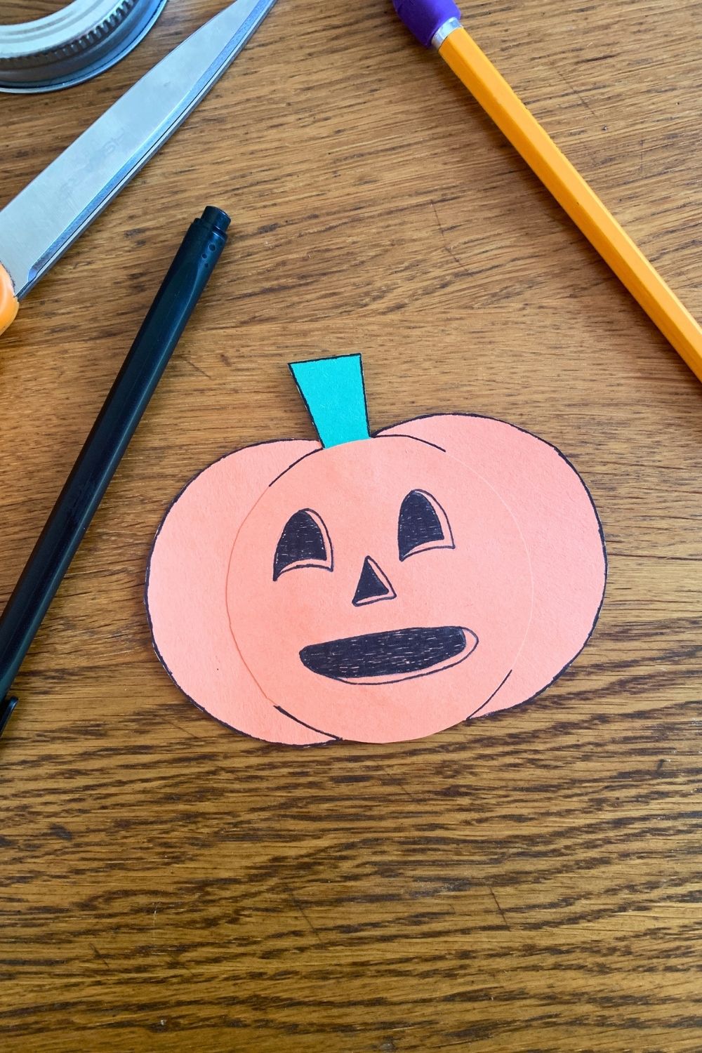 An inked jack-o'lantern face.